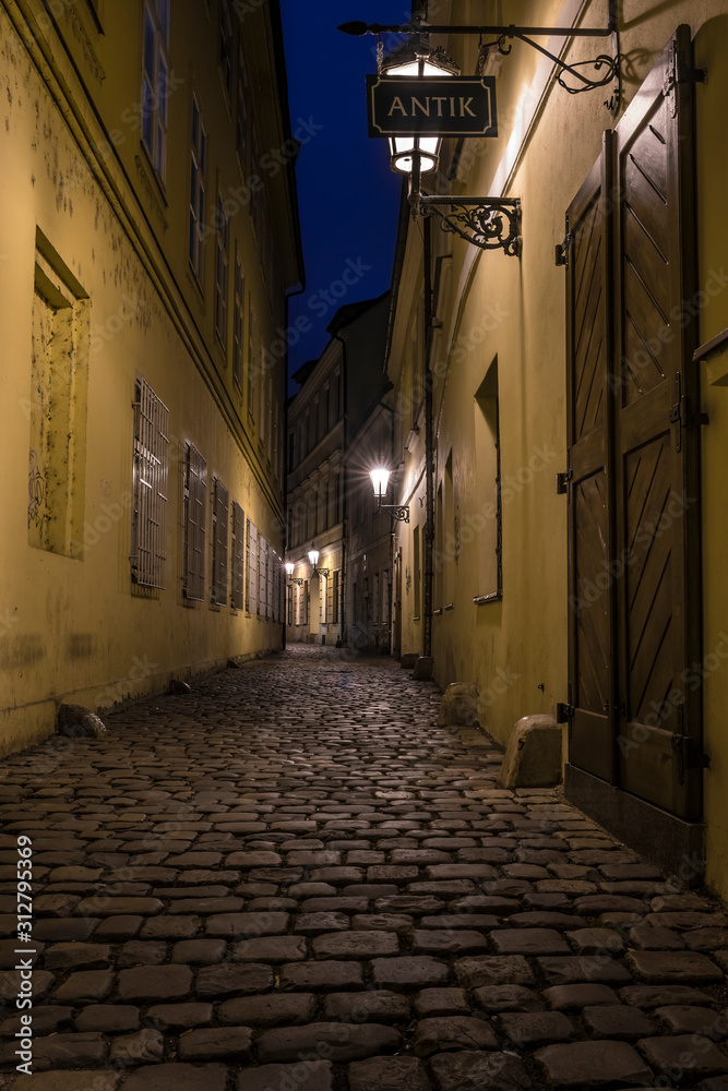 Narrow street of Praque at night.