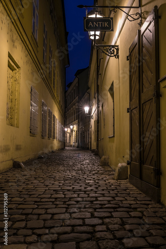 Narrow street of Praque at night.