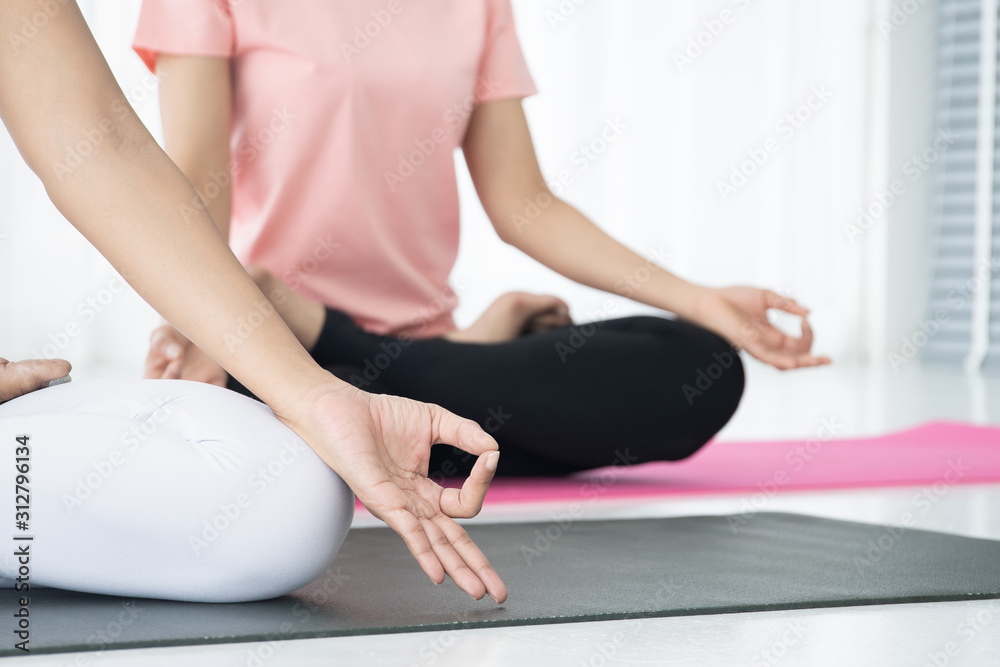 Women doing yoga exercise together