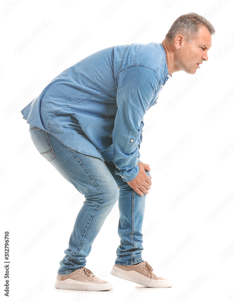 Mature man suffering from pain in knee on white background Mature man suffering from pain in knee on white background