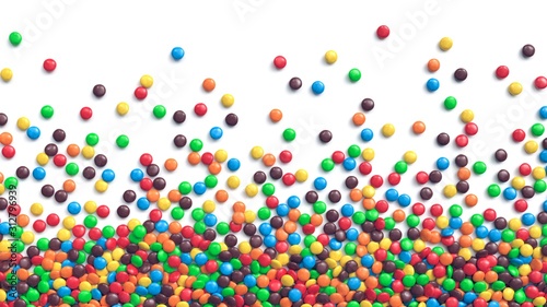 Photography Colorful coated chocolate candies scattered on white background