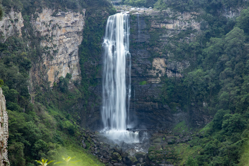 Karkloof Falls. Large Waterfall In a Lush Green Forest In Howick, South Africa. Surrounded By Mountain Cliffs, Trees and A Strong, Powerful Waterfall.