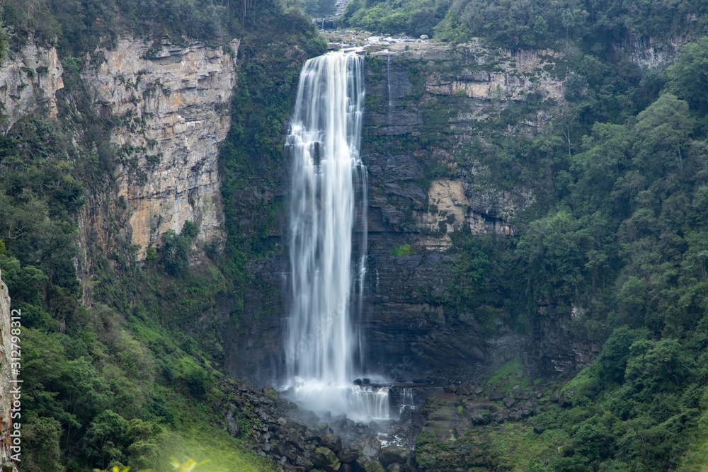 Karkloof Falls. Large Waterfall In a Lush Green Forest In Howick, South Africa. Surrounded By Mountain Cliffs, Trees and A Strong, Powerful Waterfall.