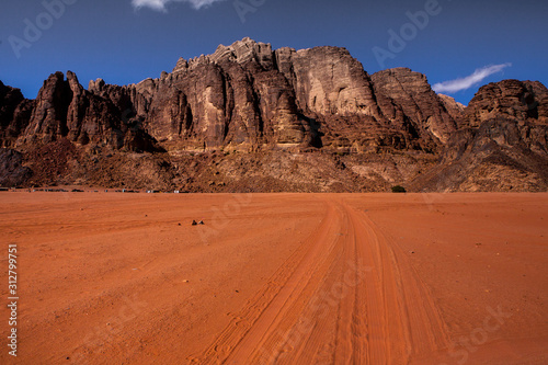 Wadi Rum Desert in Jordan. On the Sunset. Panorama of beautiful sand pattern on the dune. Desert landscape in Jordan.