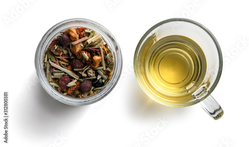 Green tea with natural aromatic additives and a Cup of tea. Top view on white background