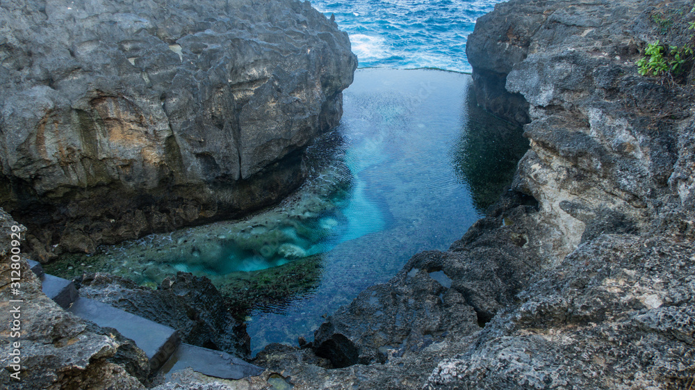 Natural, Clear Lagoon Between Cliffs Making a Bright Turquoise Billabong With Crystal Ocean Water Called Angels Billabong on Nusa Penida, Bali, Indonesia