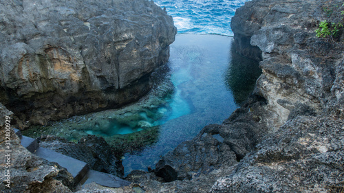 Natural, Clear Lagoon Between Cliffs Making a Bright Turquoise Billabong With Crystal Ocean Water Called Angels Billabong on Nusa Penida, Bali, Indonesia