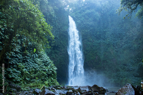 Majestic  Big and Powerful Nungnung Waterfall in The Lush Green Forests of Ubud  Bali  Indonesia