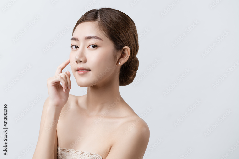 Portrait of beautiful Asian woman around 20s smiling toward the camera with confident after facial rejuvenate from beauty spa, concept woman with spa beauty treatment, facial treatment, beauty and spa Portrait of beautiful Asian woman around 20s smiling toward the camera with confident after facial rejuvenate from beauty spa, concept woman with spa beauty treatment, facial treatment, beauty and spa