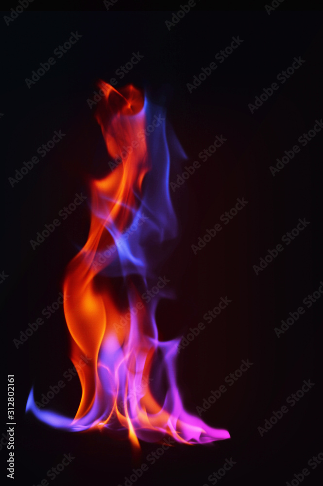 Multi Color Fire Flame Abstract on black background. A mystic colorful smoke. Blurry bright abstraction with colored lines. Magic fire