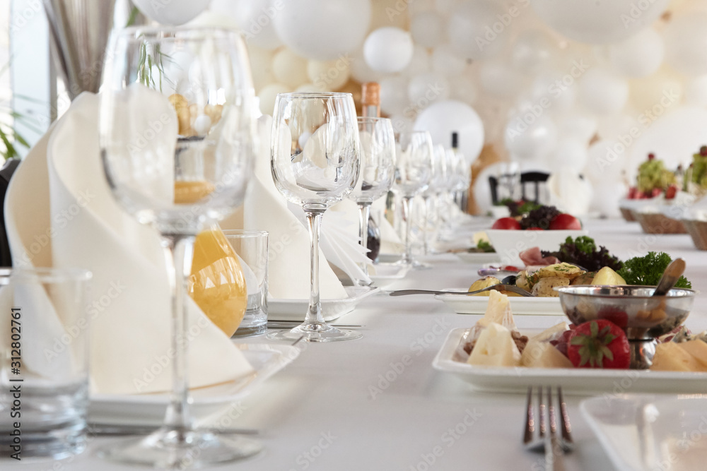 A luxurious covered table for the holiday in an expensive restaurant.	