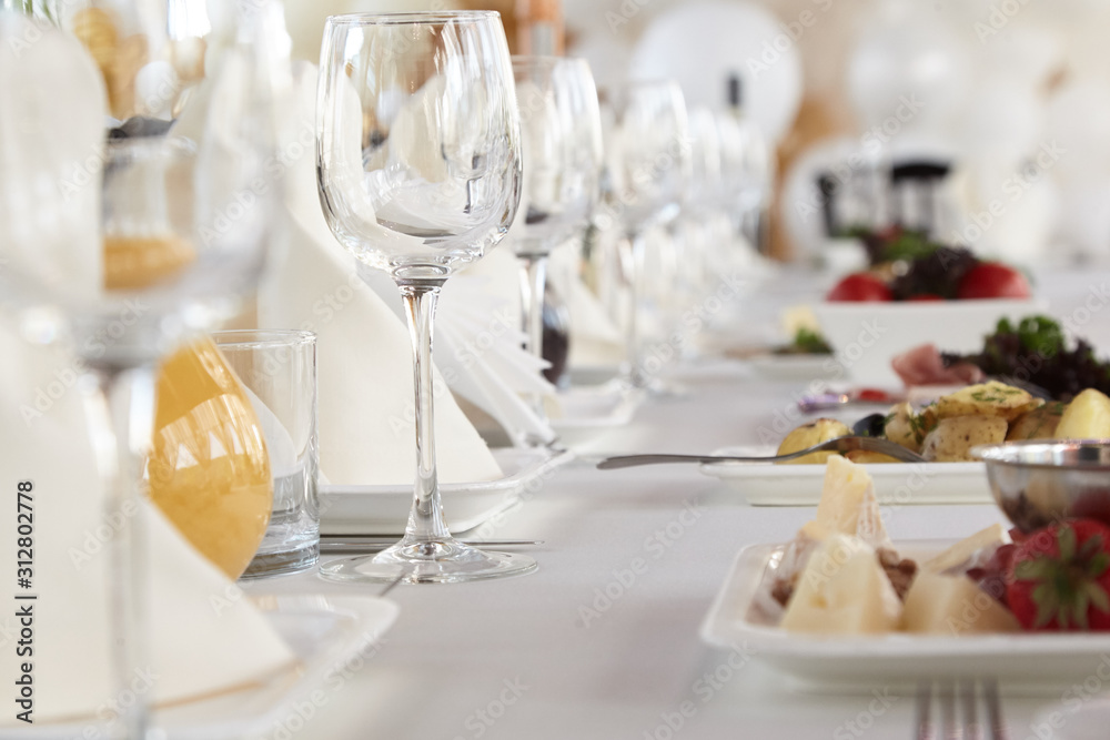 A luxurious covered table for the holiday in an expensive restaurant.	