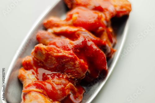 Raw and fresh chicken wings in a Chinese marinade