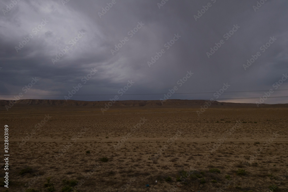 Train ride in Kazakhstan - from Astana to Mangistau. View from the train window. Sunrises, sunsets, deserts Train ride in Kazakhstan - from Astana to Mangistau. View from the train window. Sunrises, sunsets, deserts