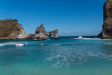Atuh Beach With Famouse Rock Island Outcrop and Natural Arch Carved By The Bright Turquoise Ocean on Nusa Penida, Bali, Indonesia