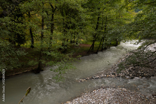 Abkhazia. Jeep trip to the mountains. The Gega waterfall, lake Riza photo