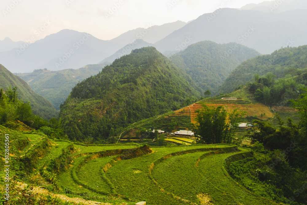 Scenery of valley with rice terraces surrounded with mountains of Sapa, Vietnam Scenery of valley with rice terraces surrounded with mountains of Sapa, Vietnam