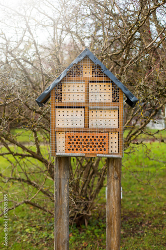 Wooden insect house decorative bug hotel. © Oleksandr