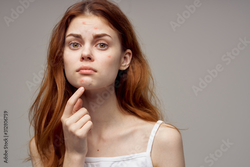 young woman with finger on her lips photo