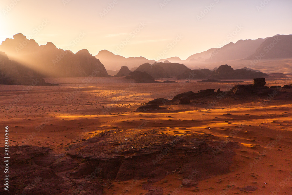 Wadi Rum Desert in Jordan. On the Sunset. Panorama of beautiful sand pattern on the dune. Desert landscape in Jordan. Wadi Rum Desert in Jordan. On the Sunset. Panorama of beautiful sand pattern on the dune. Desert landscape in Jordan.