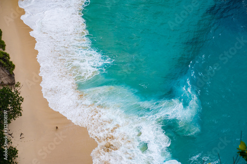 Turquoise Water On The Sandy Coast of Kelingking Beach On Nusa Penida, Bali, Indonesia From Above