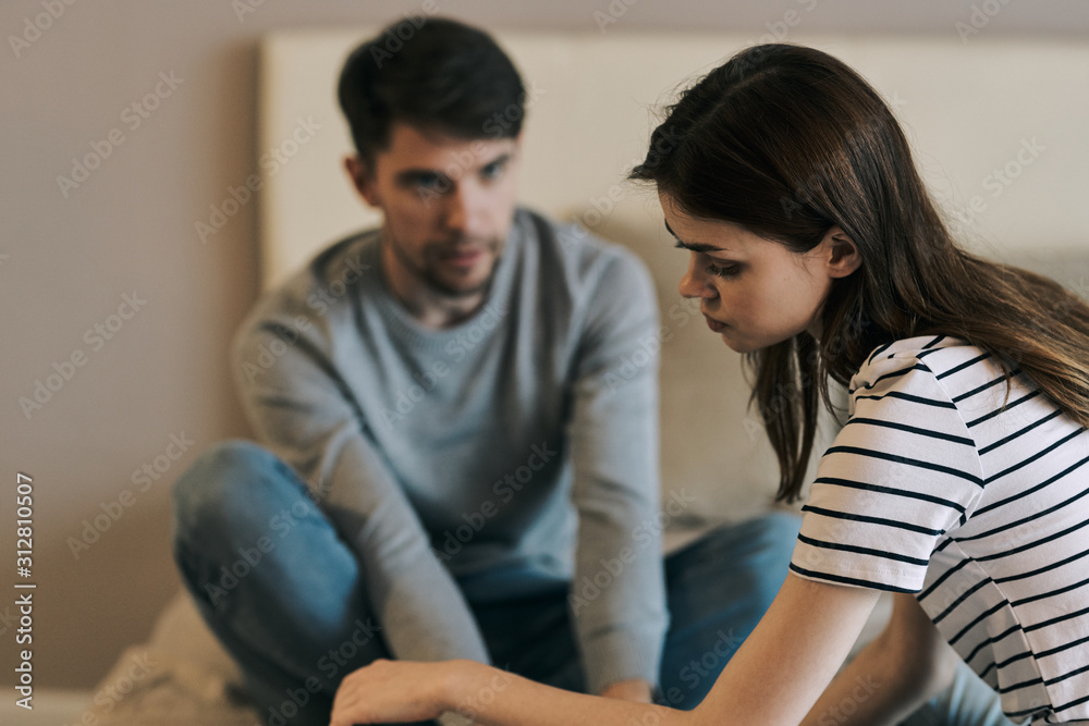 young couple sitting on sofa