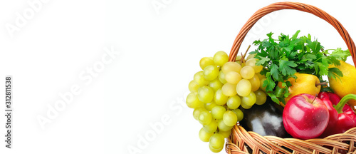 Vegetables and fruits in a basket isolated on white background. Free space for text. Wide photo photo