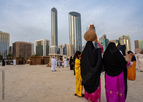 Arabian woman in traditional dress (Abaya) - Emirati dress - traditional and heritage celebrations | vintage and history photo