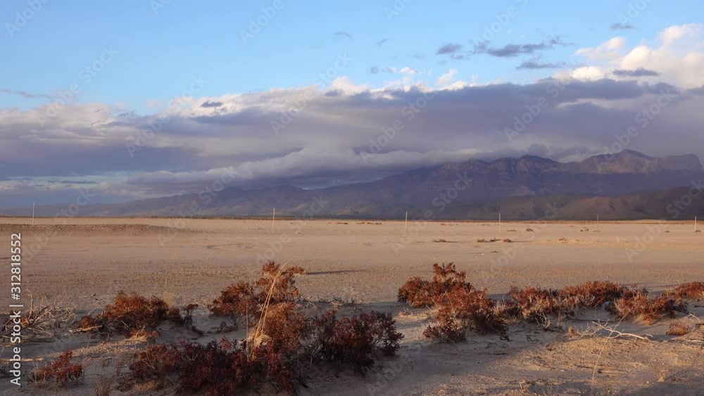 Thunderclouds move over the mountains in the evening at sunset. New Mexico Mountain Peaks. Thunderclouds move over the mountains in the evening at sunset. New Mexico Mountain Peaks.