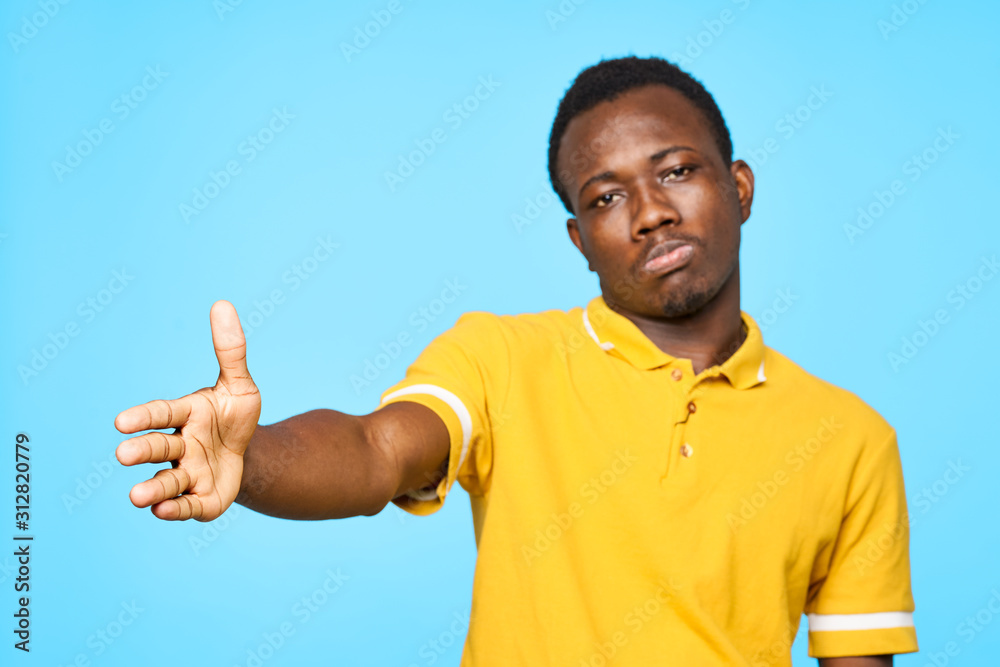 young man showing thumbs up sign young man showing thumbs up sign