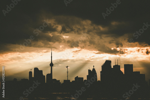 Photography A high-contrast view of the Toronto skyline with a dramatic sky covered in cloud