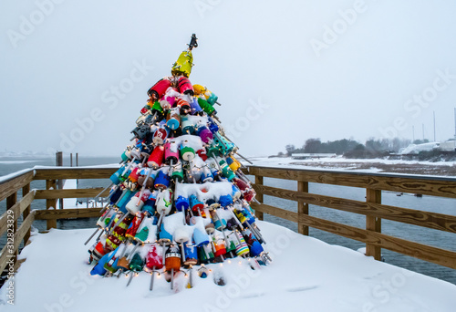 Christmas tree buoys, lights, and snow in Wells, Maine.