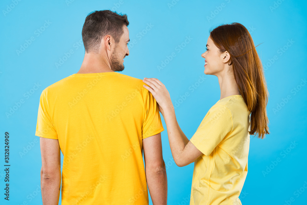 Fototapeta premium young couple in t-shirts chatting