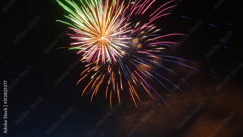 Night shot of beautiful abstract fireworks in festive New Years Eve celebration Night shot of beautiful abstract fireworks in festive New Years Eve celebration