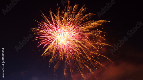 Night shot of beautiful abstract fireworks in festive New Years Eve celebration