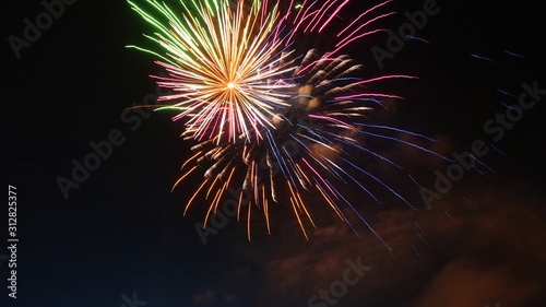 Night shot of beautiful abstract fireworks in festive New Years Eve celebration