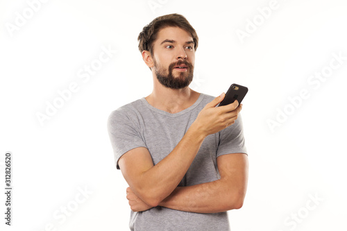 portrait of young man with mobile phone © SHOTPRIME STUDIO