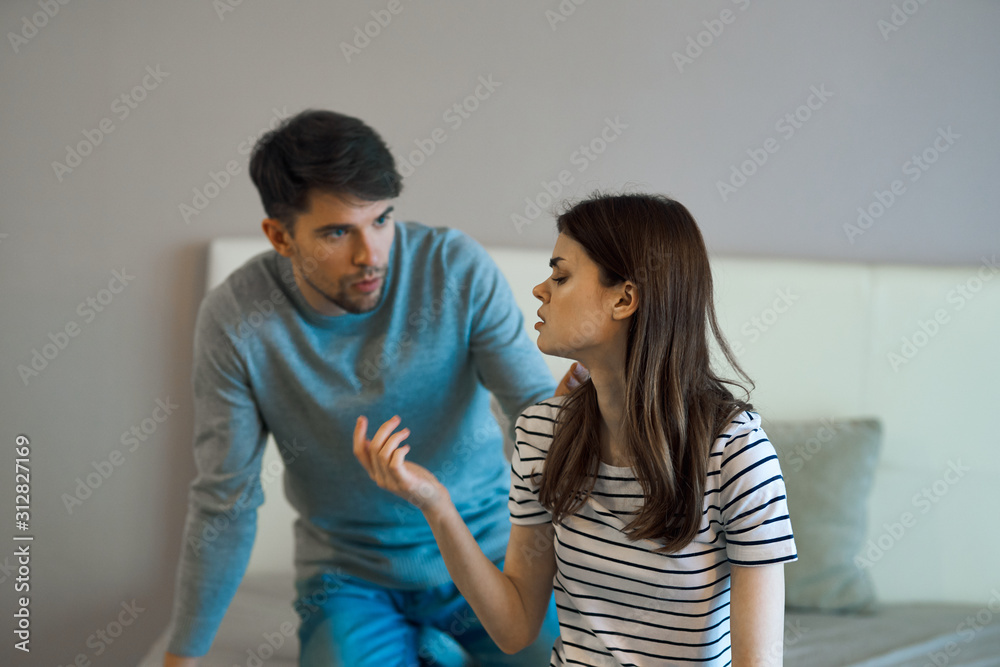 young couple in t-shirts chatting young couple in t-shirts chatting