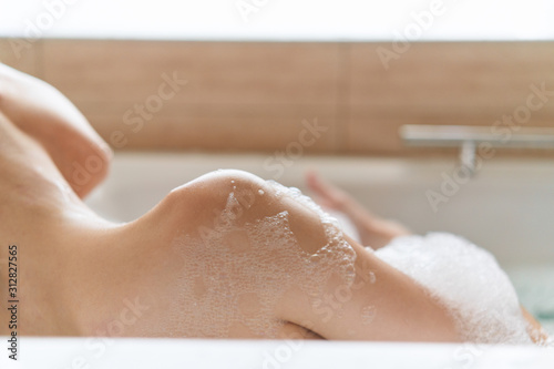 woman washing hands in bathroom