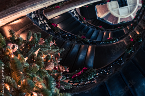 Christmas tree lookover the stairs photo