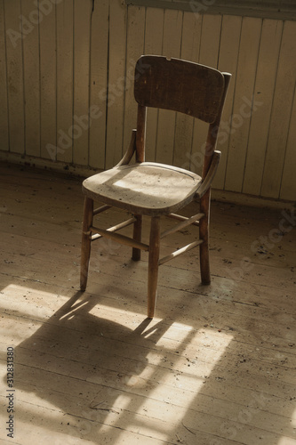 Wooden antique chair and sunlight