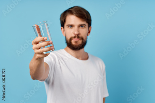 young man with a magnifying glass of water
