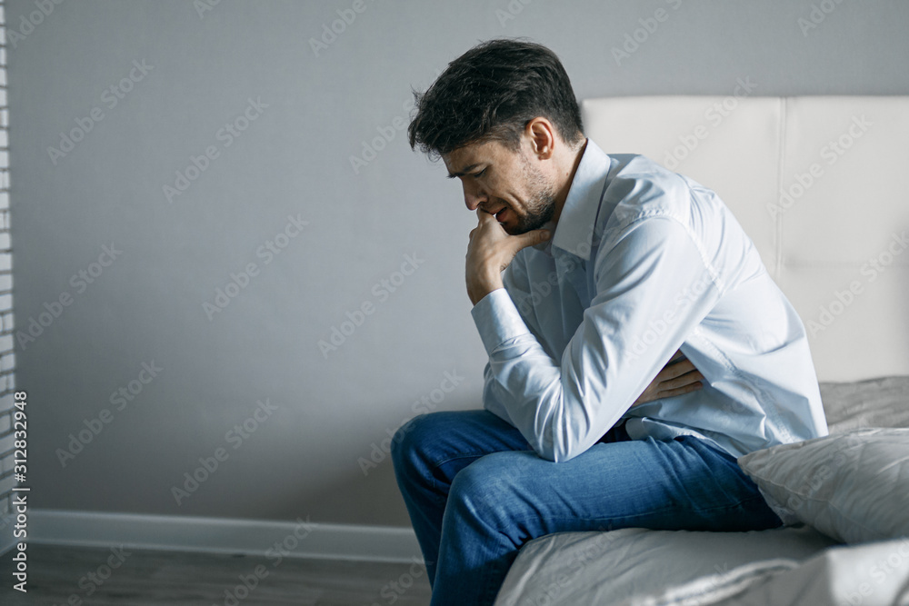 young man sitting on the floor young man sitting on the floor