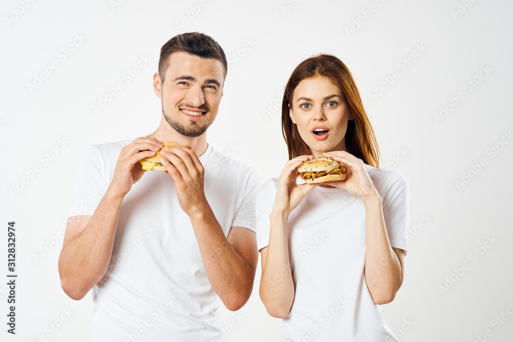 man and woman eating pizza isolated on white man and woman eating pizza isolated on white
