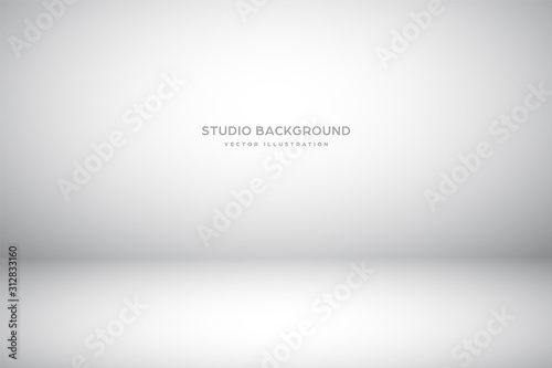 Empty gray studio abstract background with spotlight effect. Product showcase backdrop.
