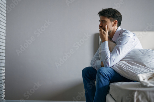 portrait of a businessman sitting on sofa © SHOTPRIME STUDIO