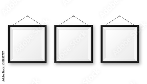 Realistic hanging on a wall blank black picture frame with shadow. Modern poster mockup isolated on white background. Empty photo frame for art gallery or interior. Vector illustration.