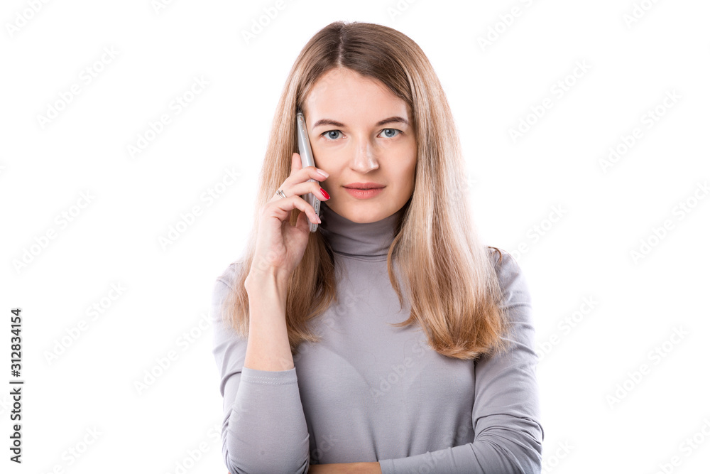 The theme of a business woman and telephone conversations. Beautiful young caucasian woman uses a smartphone handset to call in formal clothes on a white isolate background The theme of a business woman and telephone conversations. Beautiful young caucasian woman uses a smartphone handset to call in formal clothes on a white isolate background