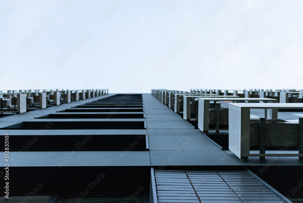 Facade baskets for air conditioners. Multystoried houses. To look up to.