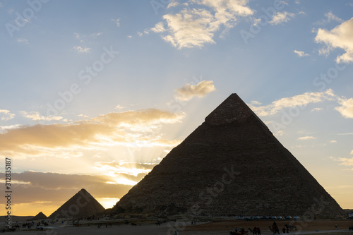 The Sun is going down behind the Pyramid of Menkaure